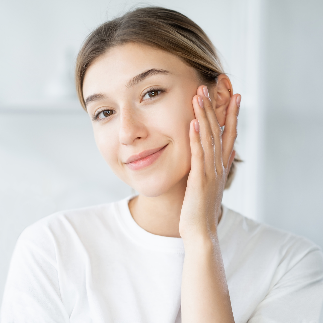 Woman with natural radiant glowing skin after using herbal skincare products